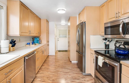 Agate House | Vibrant waterfront home with large deck, woodstove & striking sunset views