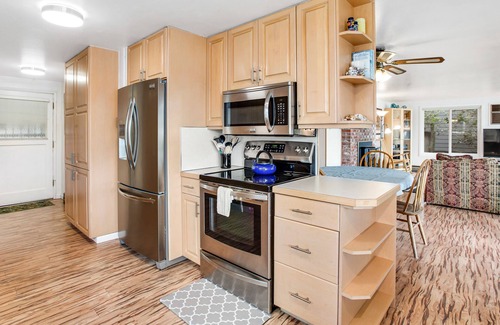 Agate House | Vibrant waterfront home with large deck, woodstove & striking sunset views