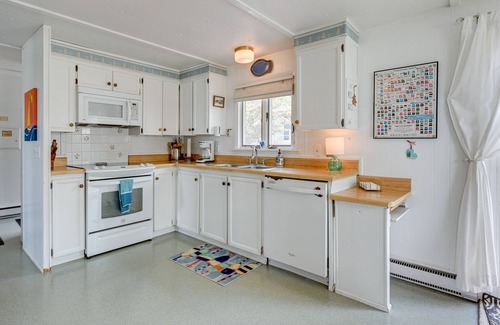 Tawas City Cottage | Vibrant Waterfront Vacation Rental on Lake Huron!