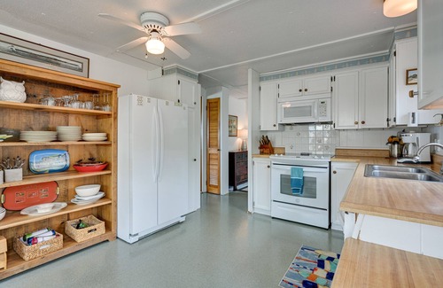 Tawas City Cottage | Vibrant Waterfront Vacation Rental on Lake Huron!