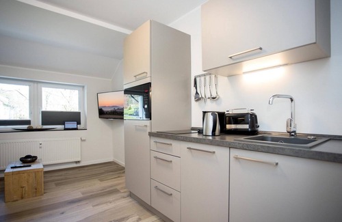 Neuastenberg Apartment | Views of the beautiful mountains of Sauerland from this practical apartment