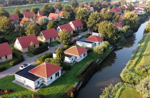 Andijk House | Villa in Friesland with Garden by Water