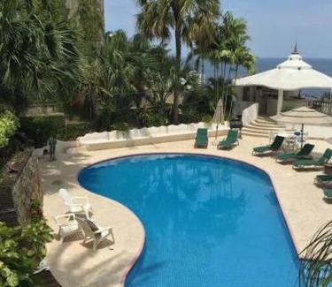 Las Playas Villa | Villa Palmitas acogedor departamento nivel piscina gigante jardines