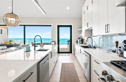Tar Bay Villa | Villa Summerwinds, , Beachfront on Flamingo Bay, Heated Pool + Carriage Home.