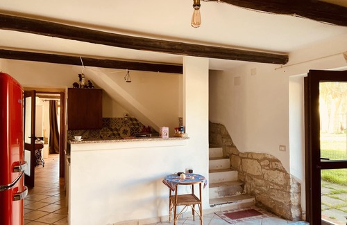 San Giovanni Suergiu Villa | Villa with garden, large windows, exposed beams and stones