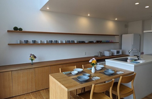 Naganuma House | Villa with glass atrium living room/Yubari-gun Hokkaidō