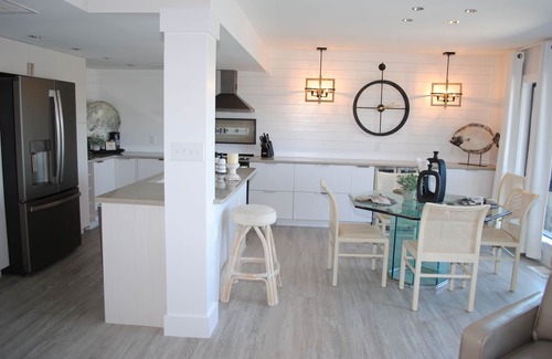 Litchfield by the Sea Condo | Villa with lake views and pool access located within gated Litchfield By the Sea community.