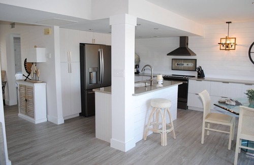 Litchfield by the Sea Condo | Villa with lake views and pool access located within gated Litchfield By the Sea community.