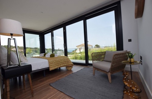 Atlanterra Ski Chalet | Villa with spectacular sea views, with private pool and spa.Free Wifi.