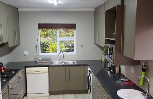 Old Place Apartment | VillaChé with garden aspect and views to Lagoon
