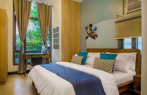 Pinagsama Apartment | Vintage Mickey Disney Stay in BGC -200mbps wifi