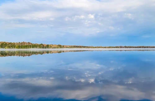 Presque Isle House | Vintage waterfront suite on South Turtle Lake with on-site dock & rowboats