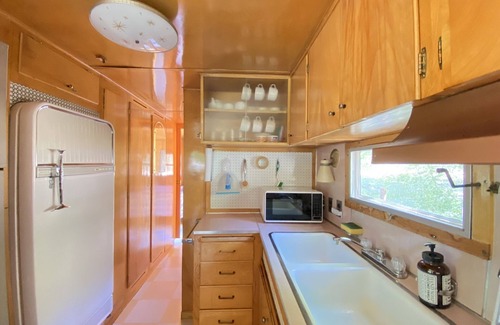 Kernville House | Vintage wood paneled travel trailer on Kernville Ranch with horses and hot tub