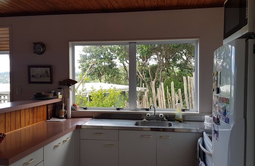 Langs Beach House | Virtually beachfront family bach, secluded Ding Bay (Langs)