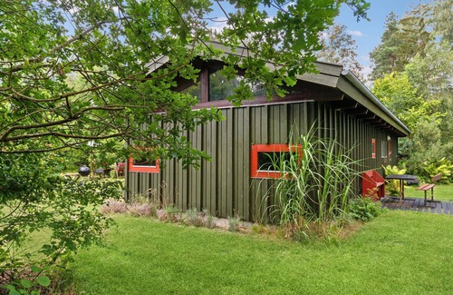 Rrvig House | Visit this charming wooden house surrounded by wonderful nature.