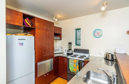 Mangawhai Heads House | Vitamin Sea - Quirky holiday home in bush setting with views, walk to the estuary and surf beach