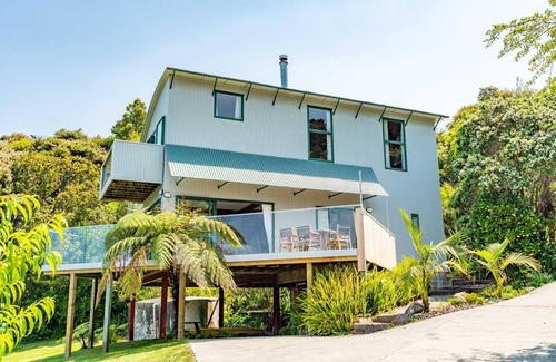 Mangawhai Heads House | Vitamin Sea - Quirky holiday home in bush setting with views, walk to the estuary and surf beach