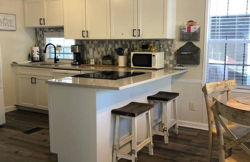 Lower Grand Lagoon Cottage | VO Resort: w/golf cart, beach/bay access, boat dock, fish pier, mini golf & more