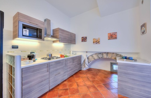 Arona Apartment | Volo Di Gabbiani Pied Dans L' Eau, Arona, Italy