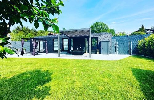 Traisen House | Voralpen Lodge - Ferienhaus mit Gym & Wellnessbereich