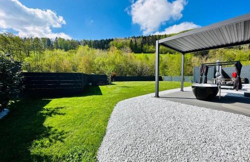 Traisen House | Voralpen Lodge - Ferienhaus mit Gym & Wellnessbereich