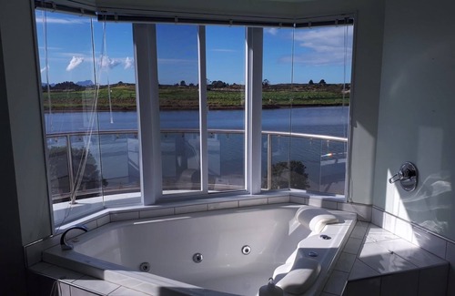 Waipu House | Waipu RiverView Retreat for the beach, cafes, golf, surf, hikes, steps to water