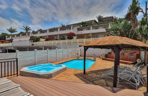 Illovo Beach Apartment | Wake up to the tranquil sight and sound of waves crashing against the shore.