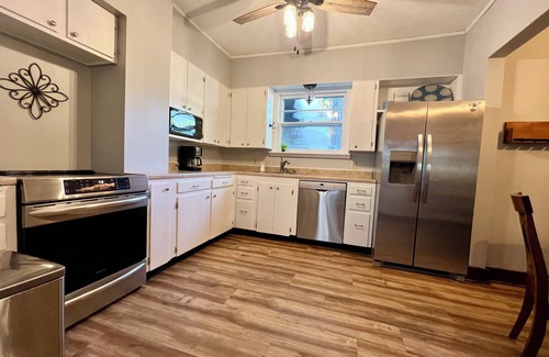 Salina House | Walk downtown, Charming 3 BR -2 King beds, Porch, Fire Pit, Theatre, Fenced Yard