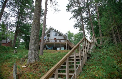Munising House | Walk out lower level with 3 beds and full private bath and fireplace.