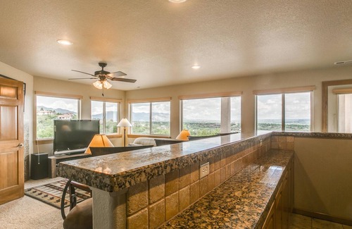 Southwest Colorado Springs Apartment | WALLS OF GLASS! Mountain top apartment, panoramic mt. views and city lights.