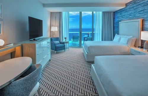 Central Beach Hotel | Warm and Inviting Beach Room with Private Balcony Overlooking the Marina