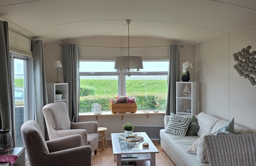Westerland Ski Chalet | Watch the sun sink into the sea from your living room at Chalet WadRust