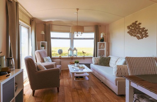Westerland Ski Chalet | Watch the sun sink into the sea from your living room at Chalet WadRust
