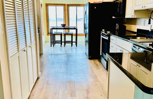 Estral Beach House | Waterfront 4 bedroom two full bath with arcade, kayaks and dock.