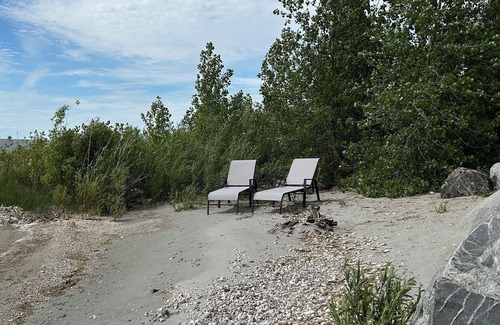 Saint Ambroise Cottage | Water's Edge cedar cabin on 1 acre lakefront: a perfect retreat summer or winter