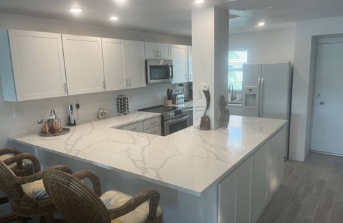 Isles of Capri Condo | WATERFONT Direct Gulf Access with Boat Slip and Covered Parking Spot