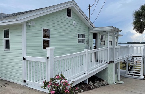 Micco House | Waterfront, 3 bedroom, original 1941 wood, fishing camp, with a deck/dock