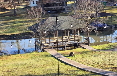 West Livingston House | Waterfront 4-bedroom estate with Indoor Pool and covered fishing dock Fire Pit