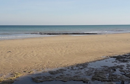 Langrune-sur-Mer Apartment | Waterfront apartment with your feet in the water!