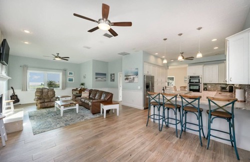 Tropic House | Waterfront Beauty: Sleeps 15, Heated Pool, Private Dock, Near Beach