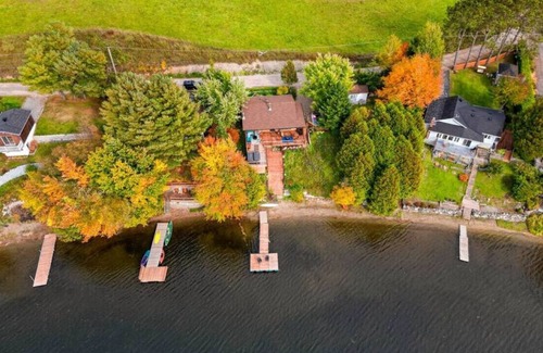 Saint-Andre-Avellin House | Waterfront Cottage with Hot Tub and Waterfalls