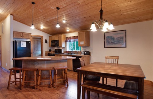 South Fork Cabin | Waterfront cabin with private hot tub, furnished deck, wood stove, & free WiFi