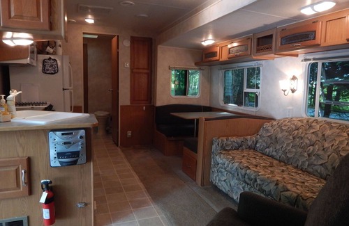 Bliss RV Rental | Waterfront camper in Adirondack-like setting