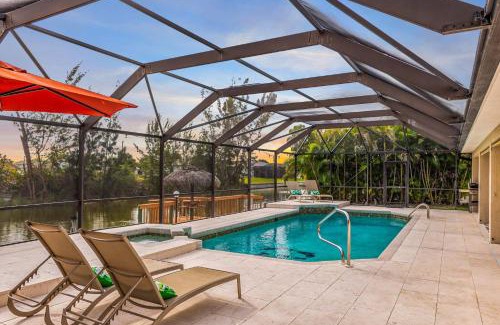 Pelican House | Waterfront Canal Home with HTD Pool Spa and Kayaks