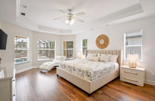 Pelican House | Waterfront Canal Home with HTD Pool Spa and Kayaks