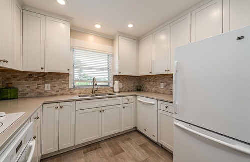 Royal Harbor Condo | Waterfront condo with New heated pool and a dock.