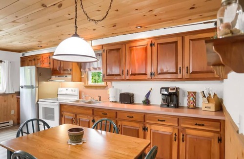 Swengel Cabin | Waterfront cottage with hot tub, & fire pit. Pet friendly.