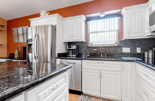 Port Isabel Cottage | Waterfront cottage with a pool, hot tub, tennis, washer/dryer, central AC