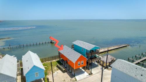 Flour Bluff House | Waterfront Escape w Views Shared Pool Boat Dock Orange Crush by AvantStay