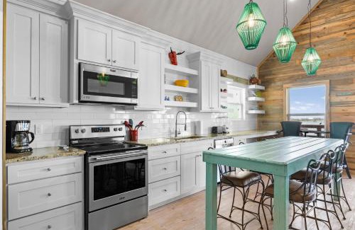 Flour Bluff House | Waterfront Escape w Views Shared Pool Boat Dock Orange Crush by AvantStay